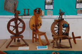 Three castle wheels on table for display.